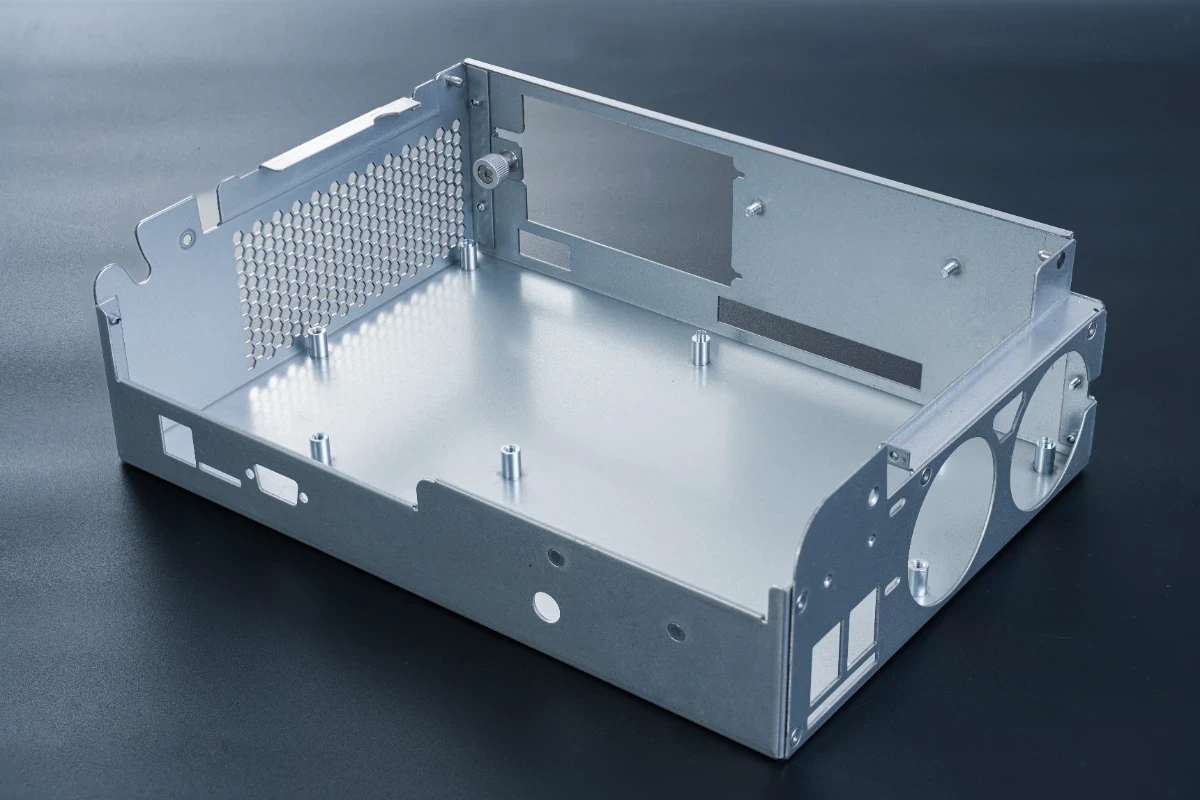 Stamped metal enclosure with perforated panel and mounting holes