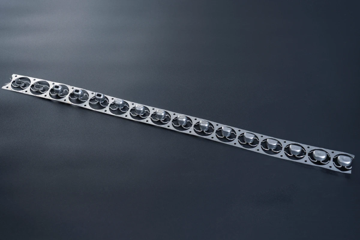 Metal stamping strip with multiple identical stamped parts