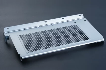 Silver metal panel with hexagonal mesh grille and hinge